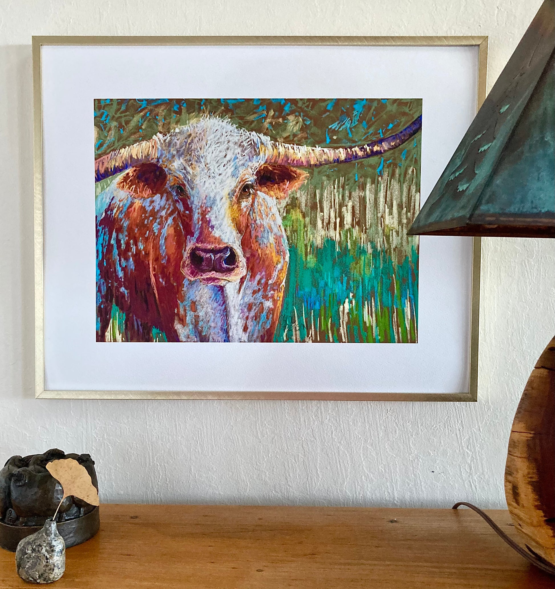 Example of cow in gold frame.