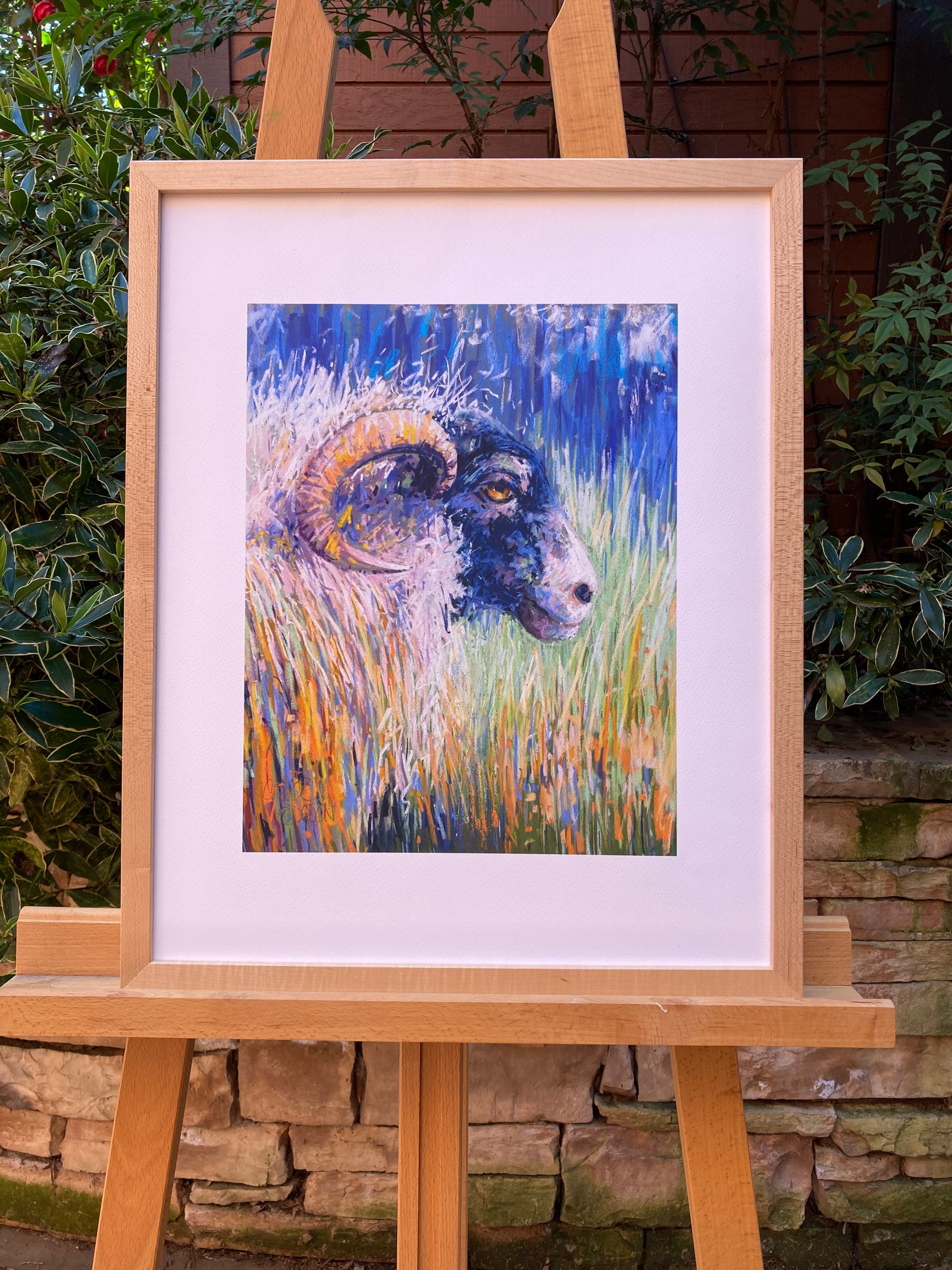 Example. Sheep print in wooden frame.